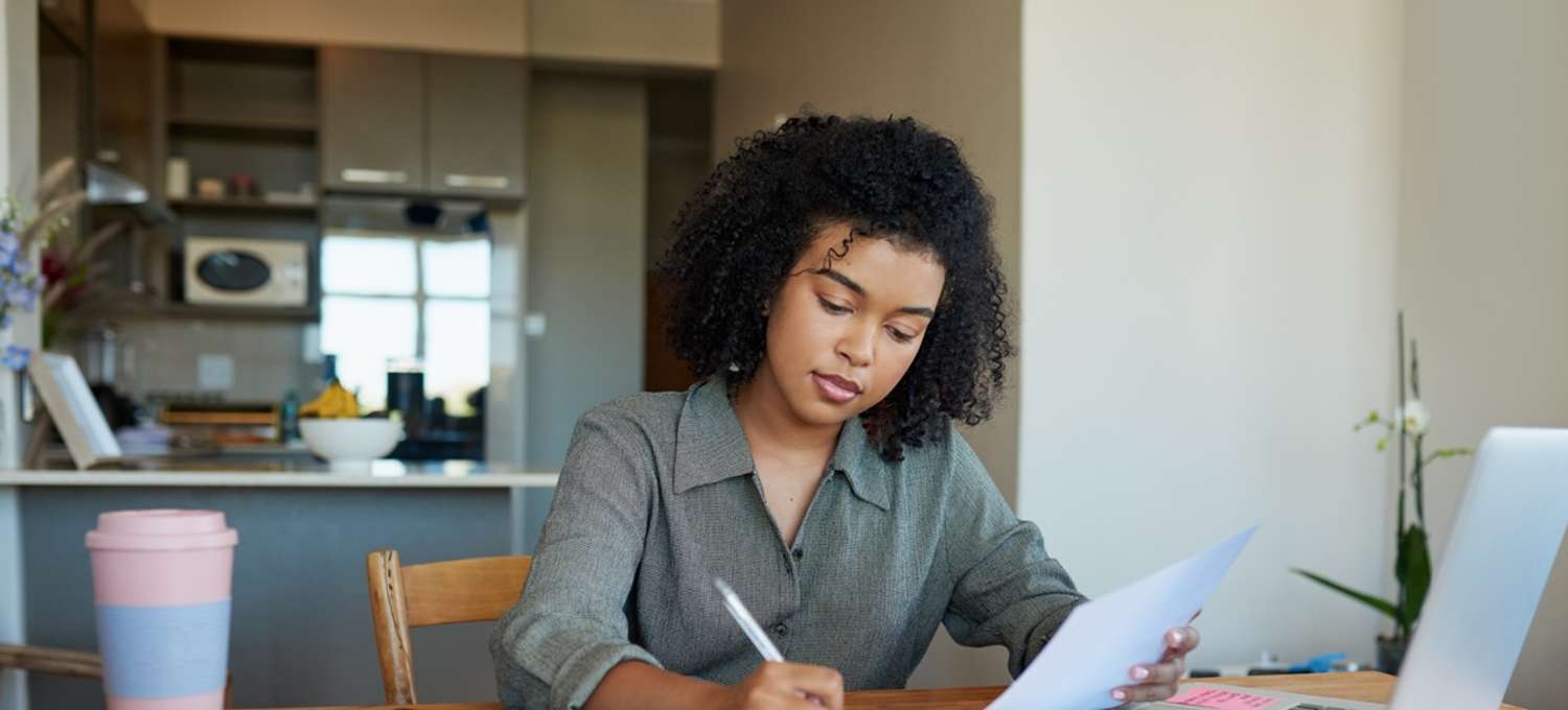 Woman preparing for an interview at home desk